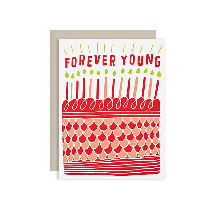 by The Good Twin. Forever Young Birthday Card. Three color screen print on French Paper. Packed in a cello sleeve with corresponding envelope. Envelope color may vary. Blank inside. Please note that due to everyone’s monitor displaying differently, the colors you see may vary. Measures 4.25 x 5.5 inches folded.