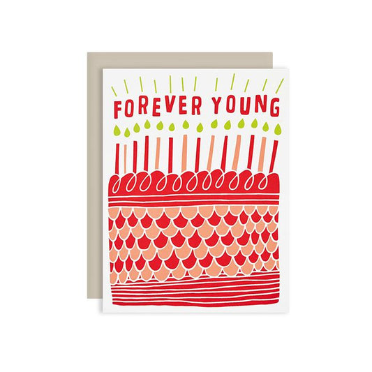 by The Good Twin. Forever Young Birthday Card. Three color screen print on French Paper. Packed in a cello sleeve with corresponding envelope. Envelope color may vary. Blank inside. Please note that due to everyone’s monitor displaying differently, the colors you see may vary. Measures 4.25 x 5.5 inches folded.