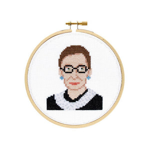 By The Stranded Stitch. You can now cross stitch a portrait of the unstoppable RBG with the Ruth Bader Ginsburg DIY Cross Stitch Kit! Kit Includes: Basic cross stitching instructions. Counted cross stitch pattern. DMC embroidery floss and color chart. 14 count white aida cloth. 5 inch Embroidery hoop. Needle. FOLD Gallery Dtla.