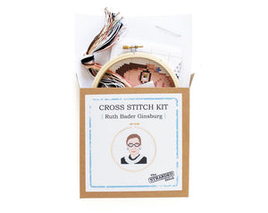 By The Stranded Stitch. You can now cross stitch a portrait of the unstoppable RBG with the Ruth Bader Ginsburg DIY Cross Stitch Kit! Kit Includes: Basic cross stitching instructions. Counted cross stitch pattern. DMC embroidery floss and color chart. 14 count white aida cloth. 5 inch Embroidery hoop. Needle. FOLD Gallery Dtla.