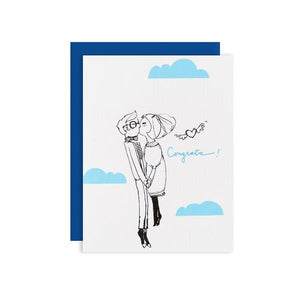 By Ilootpaperie. This folded Cloud Couple Card is printed on 100lb cardstock with subtle embossed arctic white linen finish. Inside is blank for a personal message. High quality, navy blue envelope with square flap included. Measures 4.25 x 5.5 inches. Also available in store at FOLD Gallery in DTLA.
