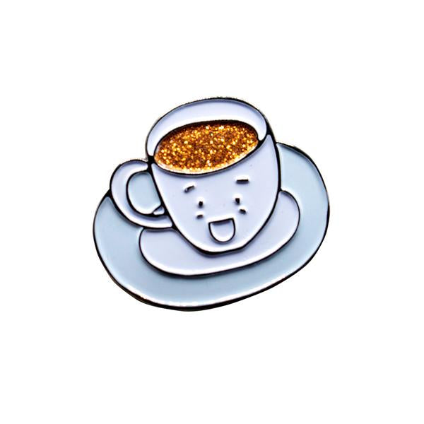 By Ilootpaperie. Soft enamel Cuppa Joe Pin with gunmetal base color and glitter detail. Ships as a single pin on card. Measures 1 inch. Also available in store at FOLD Gallery in DTLA.
