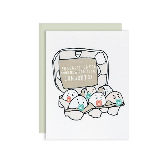 By Ilootpaperie. This folded Eggcited Baby Congrats Card is printed on premium cream linen textured 100lb cardstock. High quality, mint envelope with Euro flap included. Inside is blank for a personal message. Measures 4.25 x 5.5 inches.